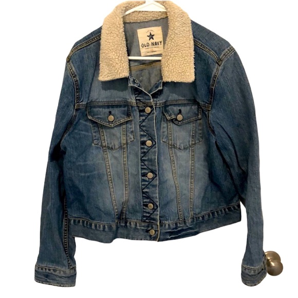 Old Navy XXL jean jacket with one tear shown in photo adjustable buttons at hip